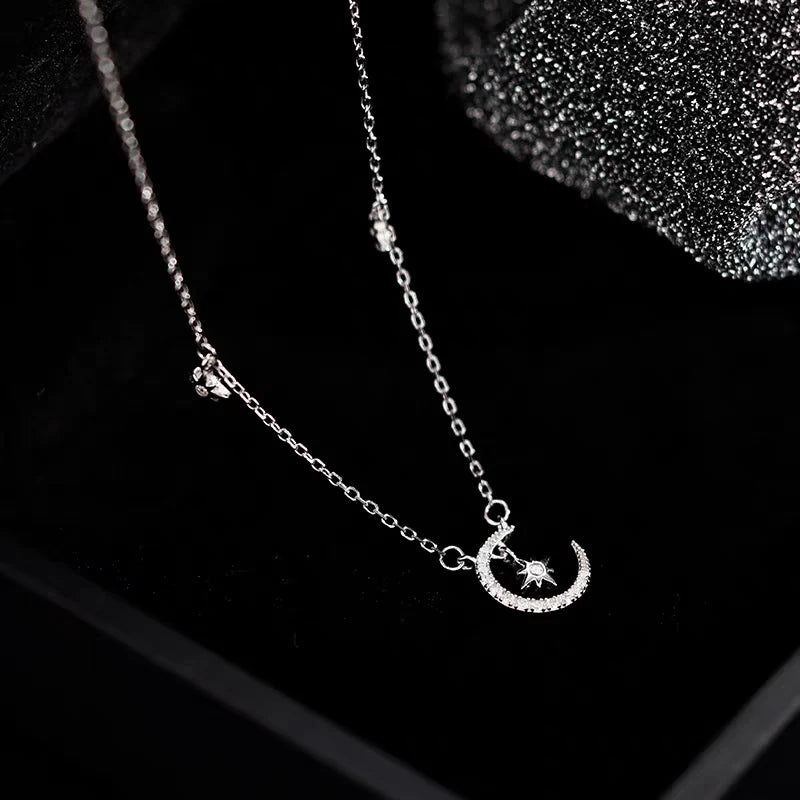 Close-up of the pendant and clasp on the Star and Moon Necklace