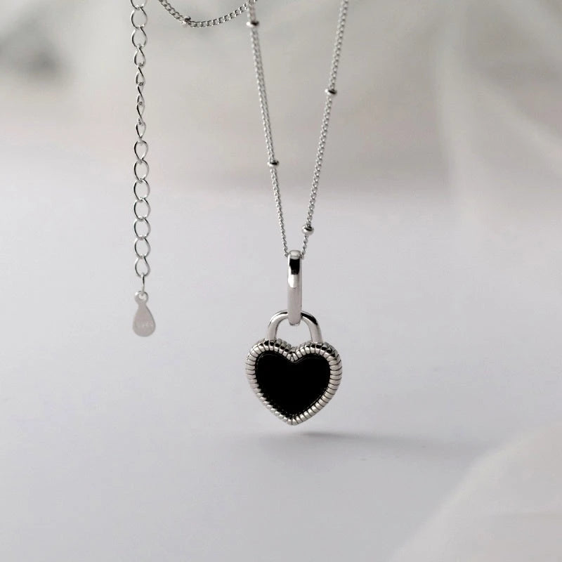 Detailed view of the Sterling Silver Luxury White And Balck Heart-Design Necklaces chain and pendant
