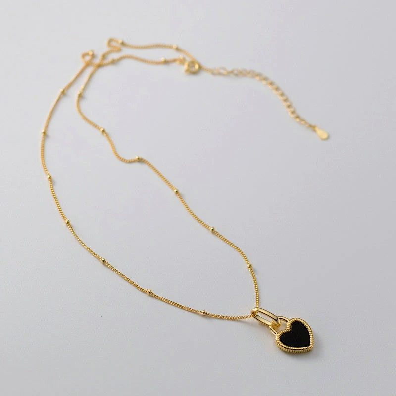 The perfect Black and White Heart Necklace for layering or wearing as a statement piece