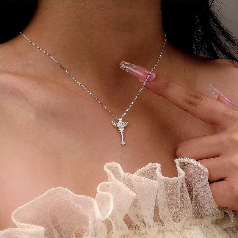Sterling Silver Luxury Zircon Angel Wing Fairy Wand Necklace worn to showcase its length and pendant detail