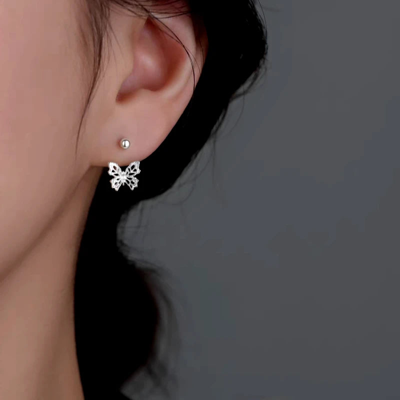 Close-up detail of the sparkling zircons and plating on the Butterfly Ear Jackets