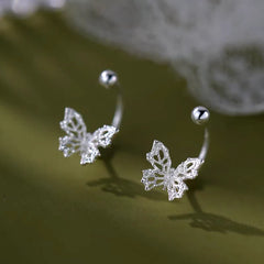 Model showcasing the dangle and style of the Sterling Silver Luxury Zircon Butterfly Screw Jacket Earrings