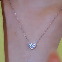 Close-up of the pendant and clasp on the Geometric Heart Necklace