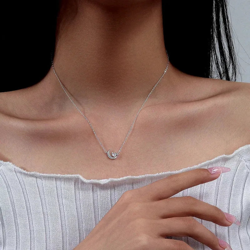 Close-up of the pendant and clasp on the Moon Heart Necklace