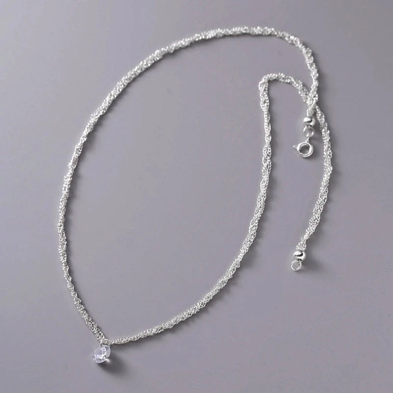 Detailed view of the Sterling Silver Luxury Zircon Multi-Layer Braided Necklace chain and pendant