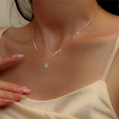 Close-up of the pendant and clasp on the Star and Moon Necklace