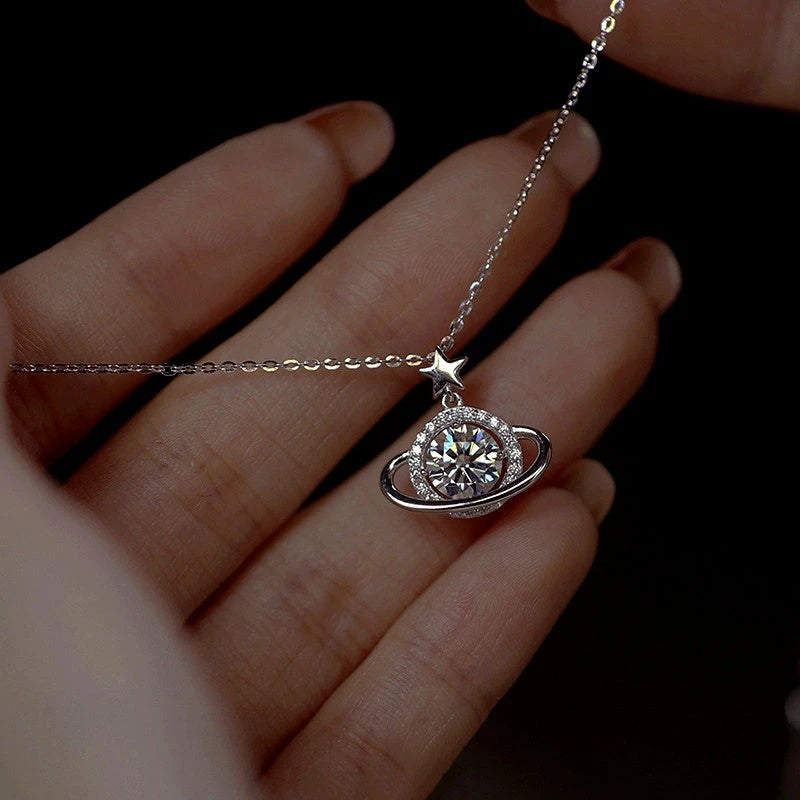 Close-up of the pendant and clasp on the Planet Moissanite Necklace