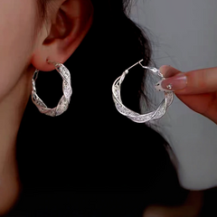 Model showcasing the dangle and style of the Sterling Silver Mesh Hoop Earrings