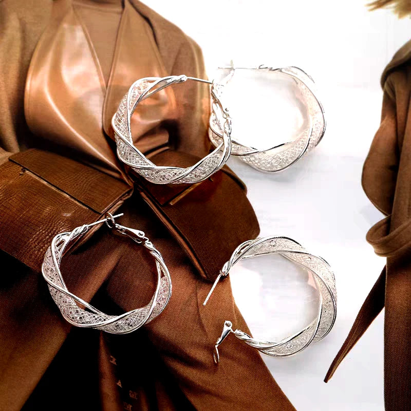 Close-up detail of the sparkling zircons and plating on the Mesh Hoop Earrings