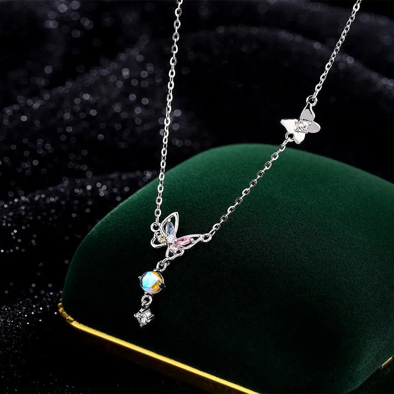 Sterling Silver Moonstone Butterfly Tassel Necklace worn to showcase its length and pendant detail