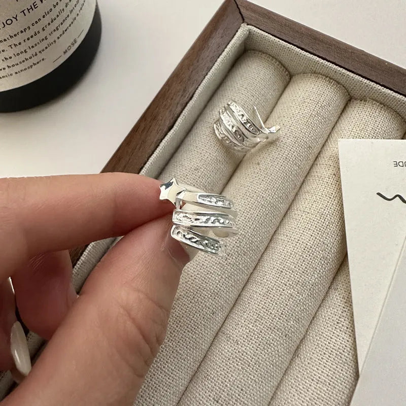 Model showcasing the dangle and style of the Sterling Silver Multi-Layer Arc Design Stud Earrings