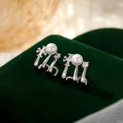 Close-up detail of the sparkling zircons and plating on the Multi-Layer Pearl Studs