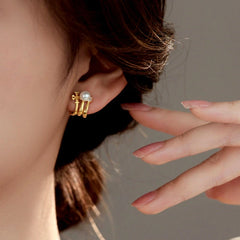 Model showcasing the dangle and style of the Sterling Silver Multi-Layer Pearl Studs