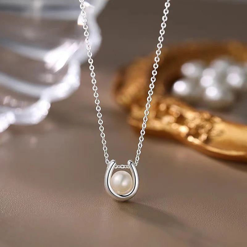 Close-up of the pendant and clasp on the Natural Pearl Necklace