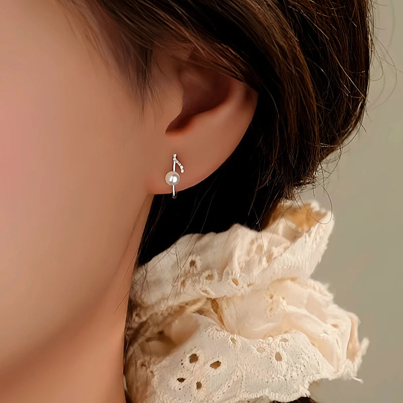 Close-up detail of the sparkling zircons and plating on the Music Note Ear Cuffs