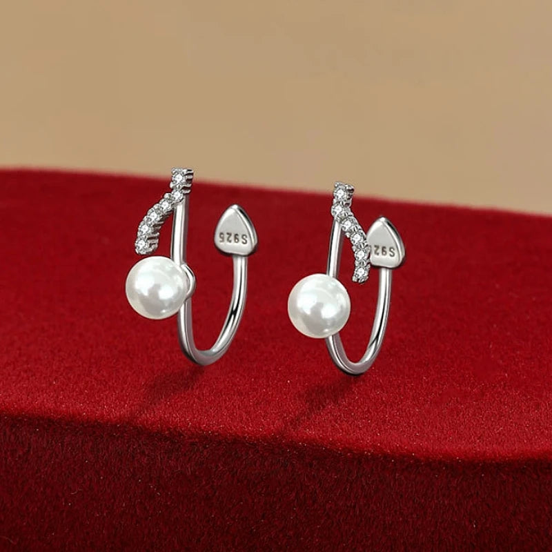 Angled view of the Sterling Silver Note Pearl Ear Clips