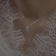 Sterling Silver One Carat Moissanite Necklace worn to showcase its length and pendant detail
