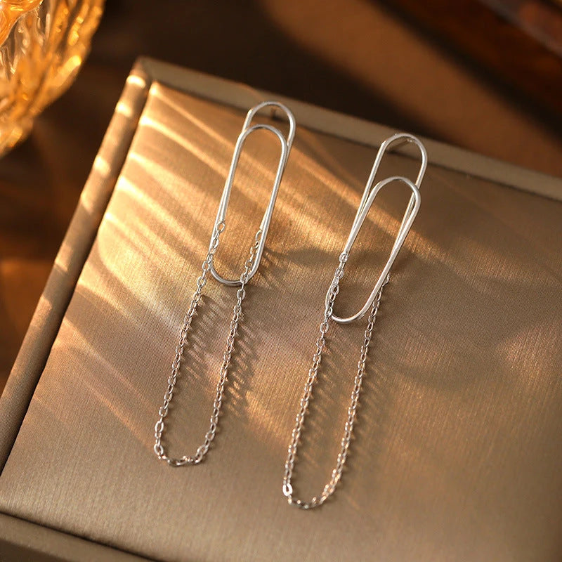 Close-up detail of the sparkling zircons and plating on the Paper Clip Tassel Earrings