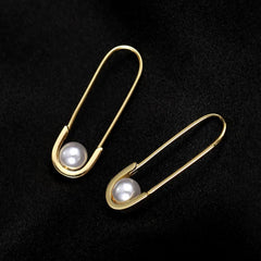 Close-up detail of the sparkling zircons and plating on the Paper Clip Pearl Earrings