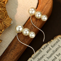 Angled view of the Sterling Silver Pearl Ear Hook Earrings