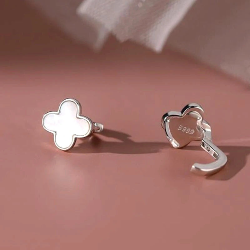 Close-up detail of the sparkling zircons and plating on the Clover Hoop Earrings