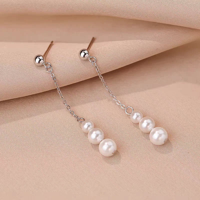 Close-up detail of the sparkling zircons and plating on the Pearl Tassel Earrings