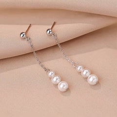 Close-up detail of the sparkling zircons and plating on the Pearl Tassel Earrings