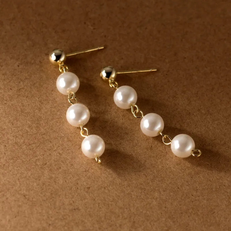 Close-up detail of the sparkling zircons and plating on the Pearl Tassel Earrings