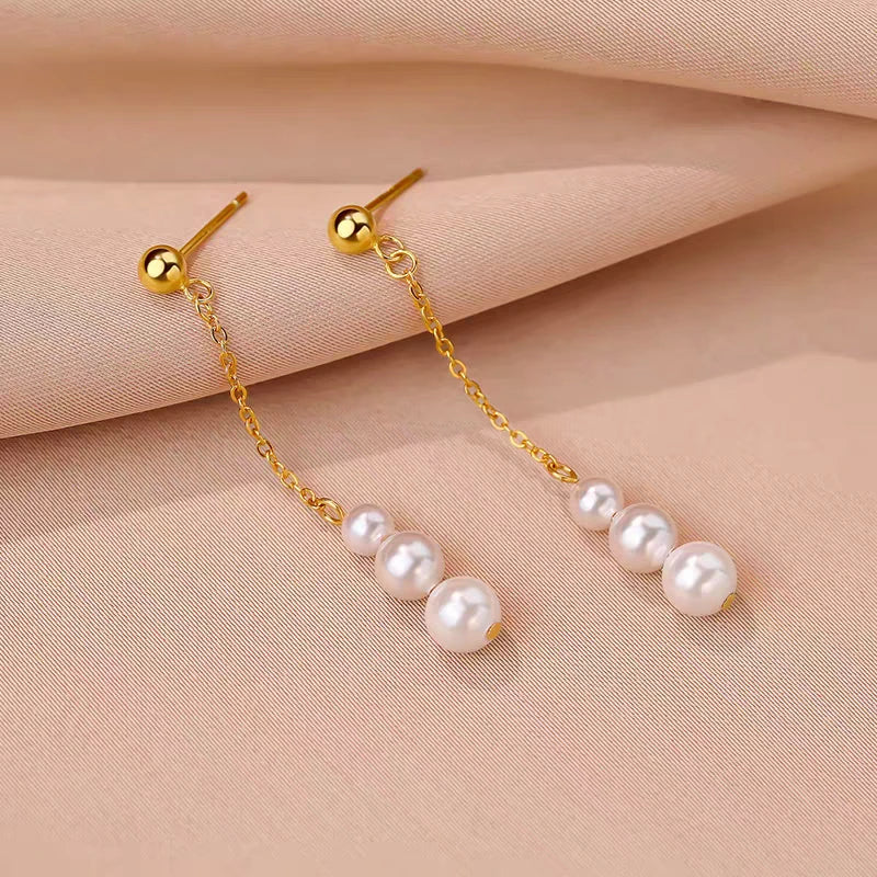 Angled view of the Sterling Silver Pearl Tassel Earrings