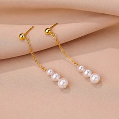 Angled view of the Sterling Silver Pearl Tassel Earrings