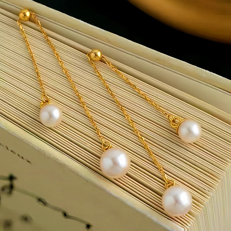Angled view of the Sterling Silver Pearl Tassel Earrings