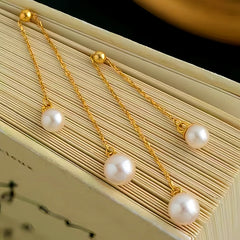Angled view of the Sterling Silver Pearl Tassel Earrings