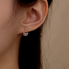 Model showcasing the dangle and style of the Sterling Silver Pink Diamond Heart Butterfly Screw Earrings