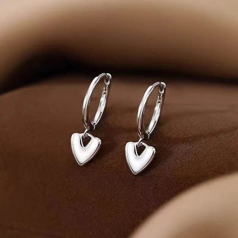 Angled view of the Sterling Silver Polished Heart Earrings