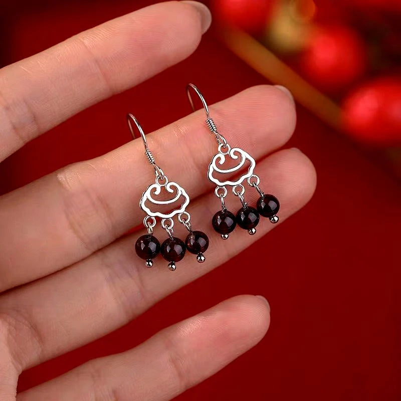 Close-up detail of the sparkling zircons and plating on the Tassel Threader Earrings