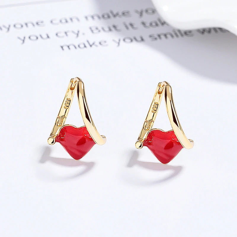 Angled view of the Sterling Silver Red Heart Earrings