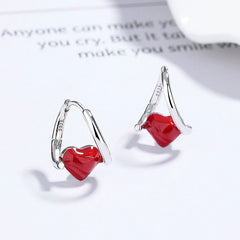 Close-up detail of the sparkling zircons and plating on the Red Heart Earrings