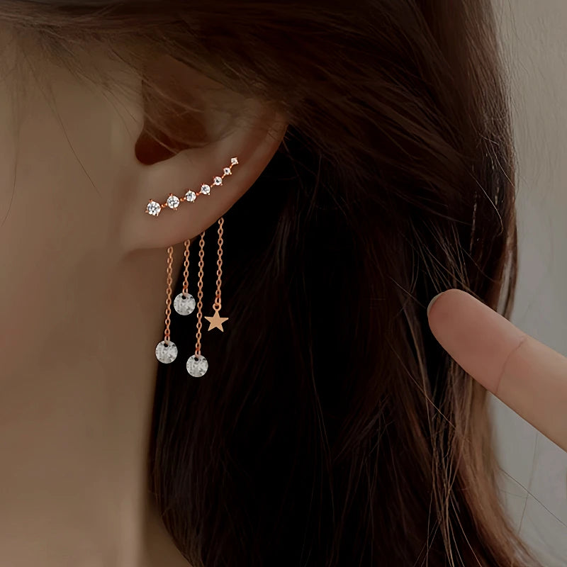 Model showcasing the dangle and style of the Sterling Silver Rose Golden Elegant Zircon Diamond Star Tassel Earrings