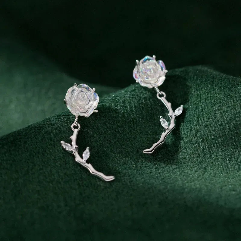 Model showcasing the dangle and style of the Sterling Silver Rose Tassel Earrings