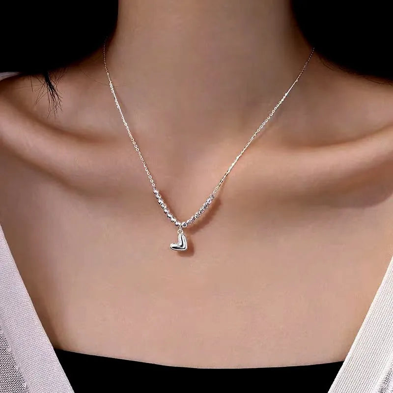 Close-up of the pendant and clasp on the Bead Heart Necklace