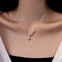 Close-up of the pendant and clasp on the Bead Heart Necklace