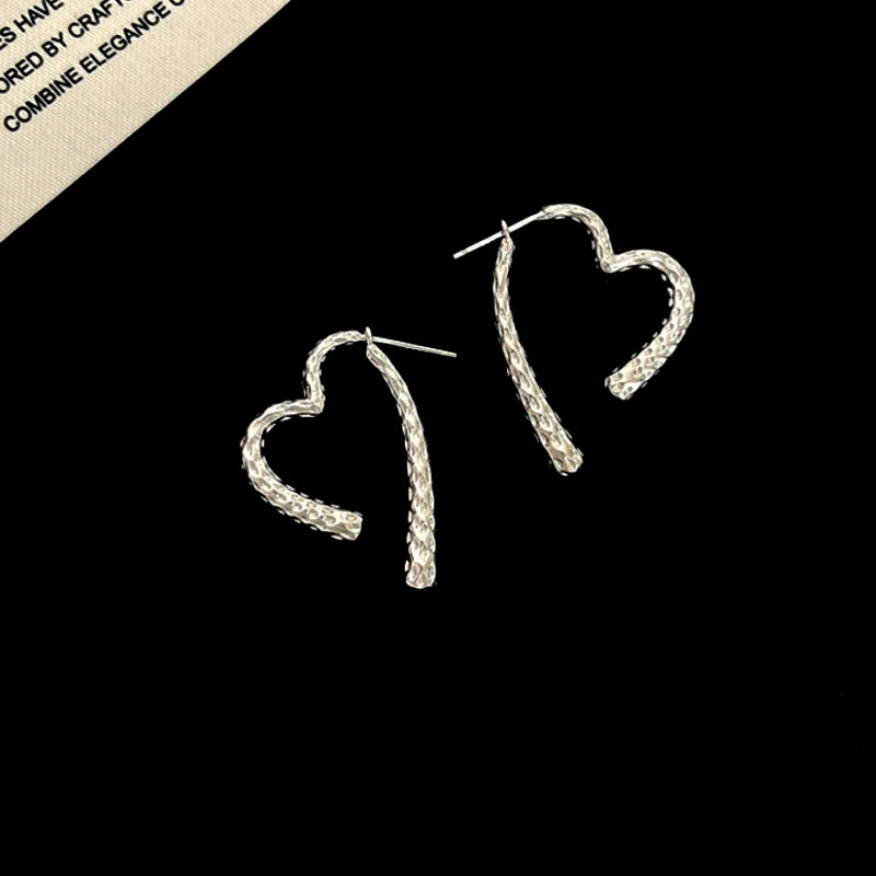 Close-up detail of the sparkling zircons and plating on the Hanging Heart Earrings