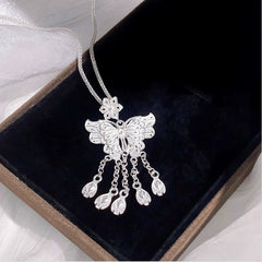 Sterling Silver S999 Sweet Flower Butterfly Tassel Earrings worn to showcase its length and pendant detail