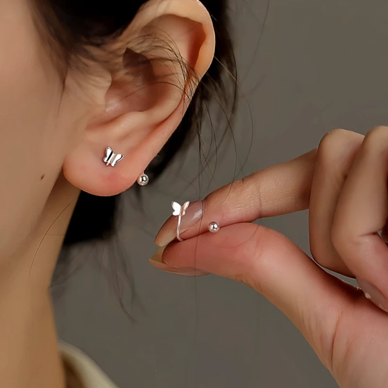 Angled view of the Sterling Silver Screw Butterfly Stud Earrings