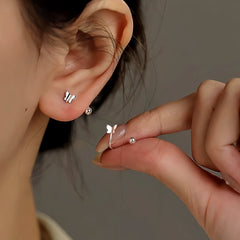 Angled view of the Sterling Silver Screw Butterfly Stud Earrings