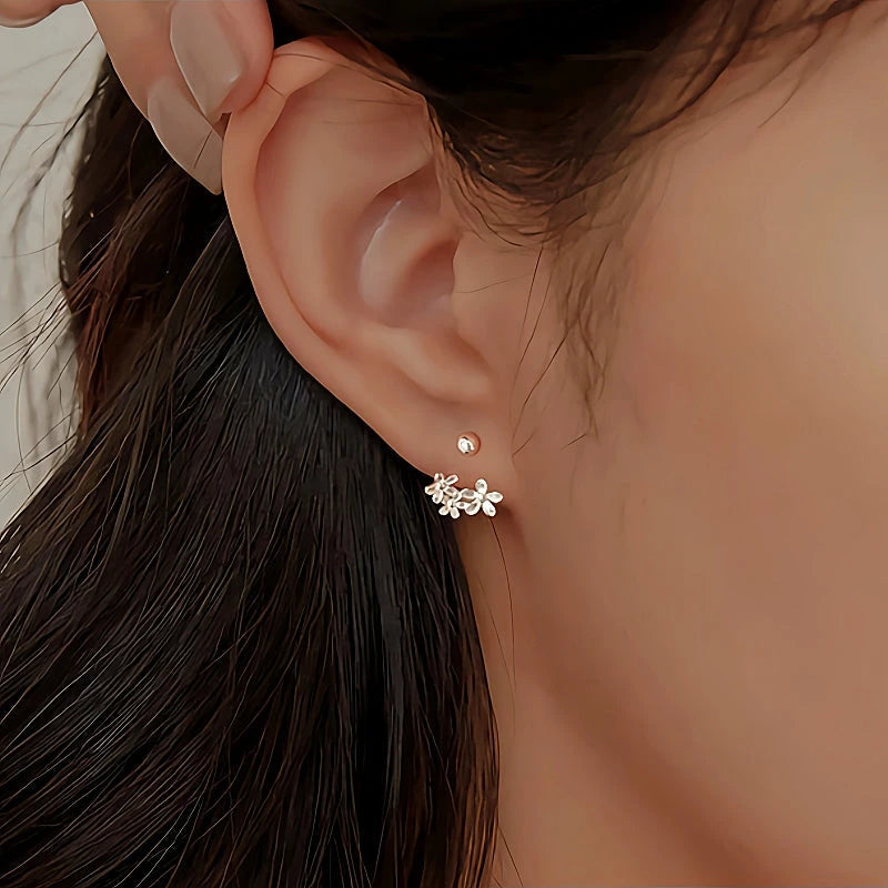 Model showcasing the dangle and style of the Sterling Silver Screw Flower Earrings