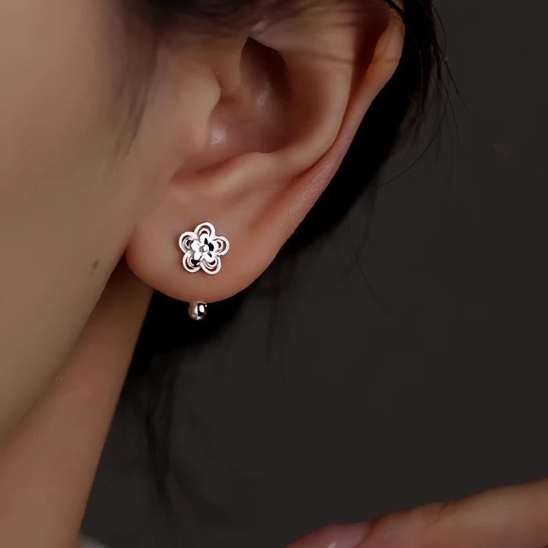 Close-up detail of the sparkling zircons and plating on the Screw Back Flower Studs