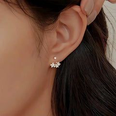 Close-up detail of the sparkling zircons and plating on the Screw Back Flower Earrings