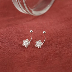 Angled view of the Sterling Silver Screw Flower Earrings