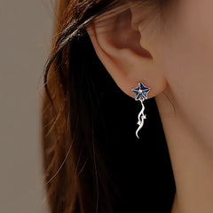 Model showcasing the dangle and style of the Sterling Silver Sea Star Necklace And Earrings